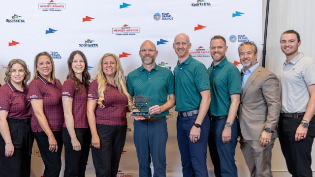 Sports Salt Lake team holding award