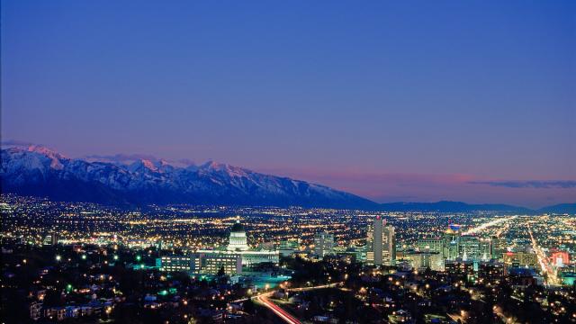 City lights view of the Utah Capitol Building and Salt Lake valley. Dusk sky with mountains in the background
