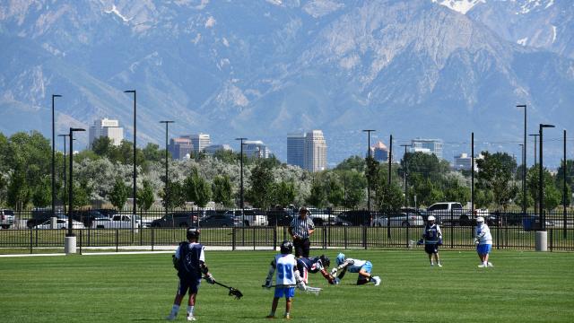 Lacrosse players on a field
