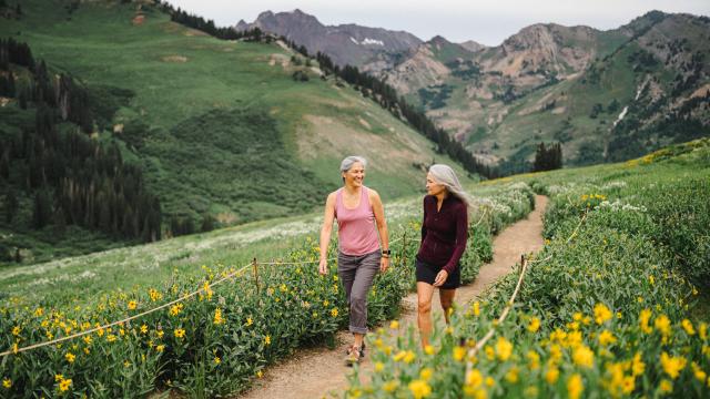 Image of two women walking through Alta Wildflowers