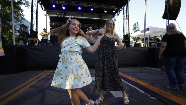 The crowd dances to a performance