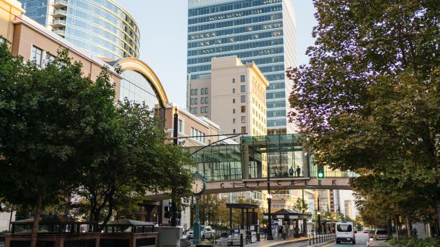 View looking south on main street in Salt Lake in summer time showing the street bridge at City Creek Center