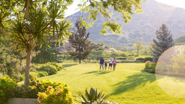 Image of a family walking through Red Butte Garden