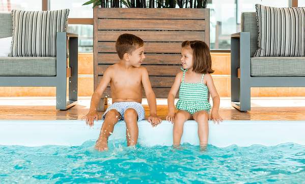 Kids at indoor pool at Four Seasons Hotel Boston