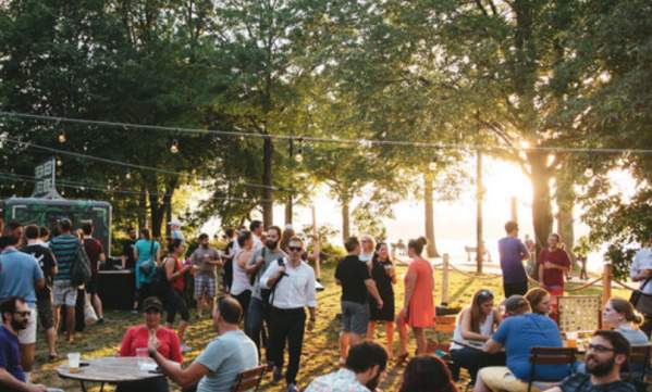 A Crowd At Owl's Nest Beer Garden In Boston, MA