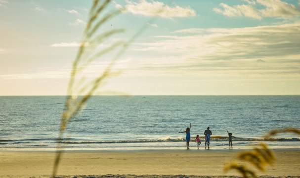 A family enjoys the solitude and peaceful beaches in Golden Isles, GA