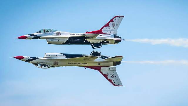 Two US Air Force Thunderbirds flying in formation