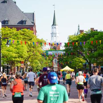 The Vermont City Marathon runners head up Church Street