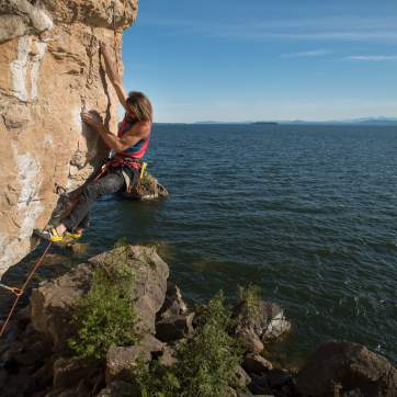 woman climbing Lone Rock
