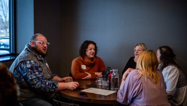 A group of meeting planners chatting