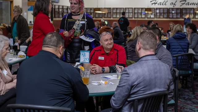 Group of people chatting a table