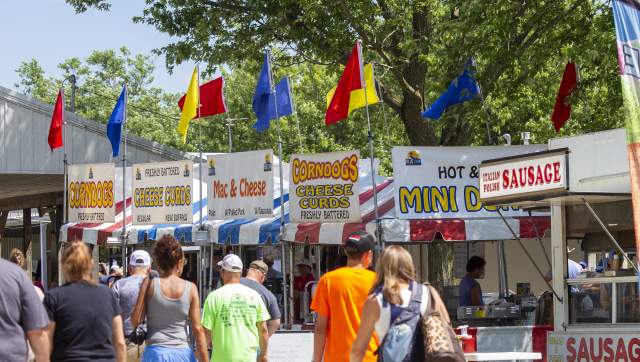 Fair set up with people walking by food vendors
