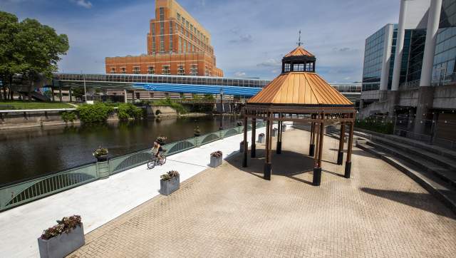 Bike rider on the Lansing River Trail in Downtown Lansing