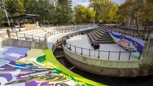 Seating and part of the mural at the new Fish Ladder Music Park