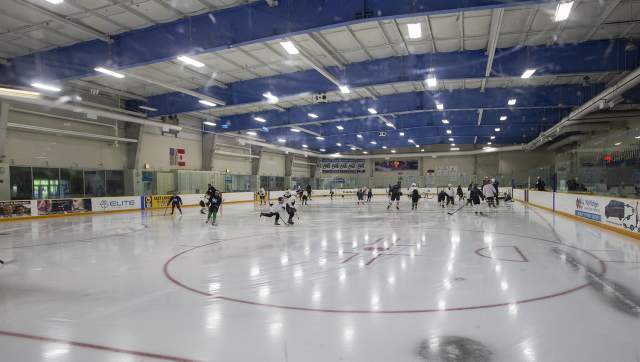 Hockey players on ice arena
