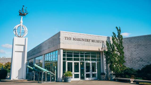 The Mariners' Museum entrance featuring a wind vane with a ship