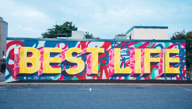 A colorful street art mural that reads: Best Life