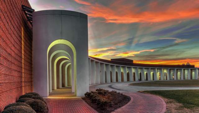 The Ferguson Center for the Arts columns with a sunset