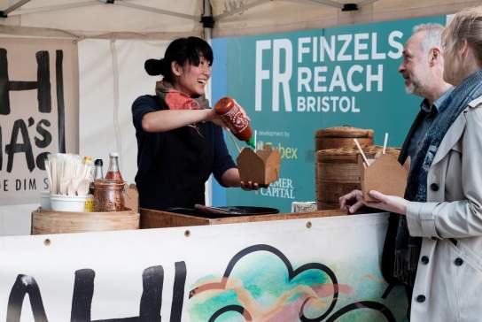 Shoppers at a stand in Finzels Reach - credit Rupert Marlow Photography