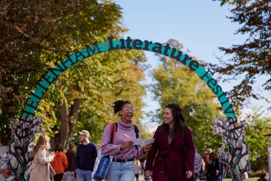 Visitors walking past the Cheltenham Literature Festival sign in Montpellier Gardens, Cheltenham.
By Still Moving Media for Cheltenham Festivals.