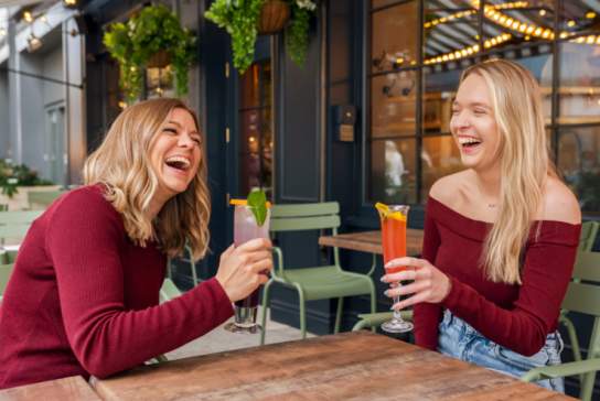 Ladies enjoying cocktails at Flight Club Cheltenham
