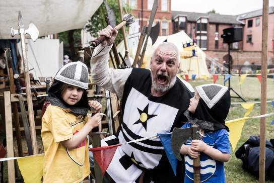 Two children and a knight at 2023 Medieval Day