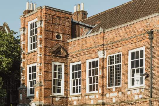 Exterior of Wilberforce House Museum in Hull’s Museums Quarter, showing its historic red‑brick Georgian architecture and large sash windows on a sunny day.