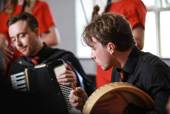 Musicians playing instruments.