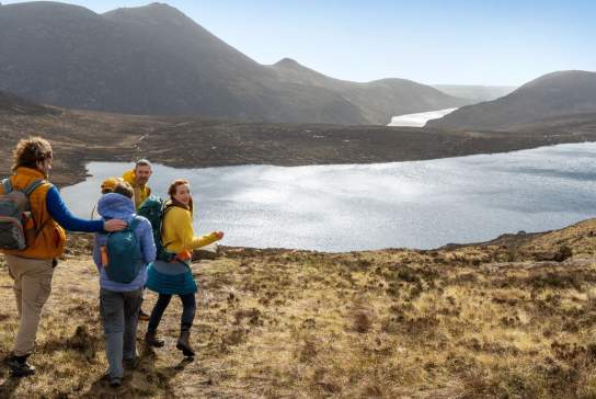 Group on bicycles enjoying the views on a tour with Mourne Mountain Adventures in County Down.