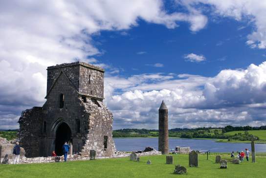 historic Devenish Island with the 12th Century round tower and St. Molaise House and Lough Erne in view