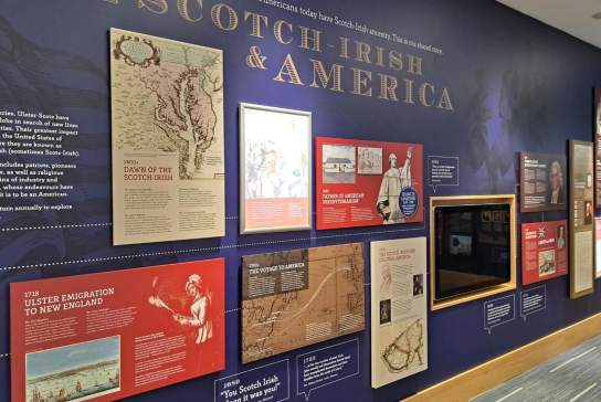 Informative exhibit wall showcasing the history of Ulster-Scots/Scotch-Irish in America. The information features maps, text panels and images