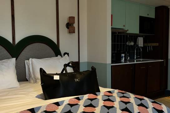 Influencer Danielle Collins personalised bag on a bed at Room 2 Belfast.