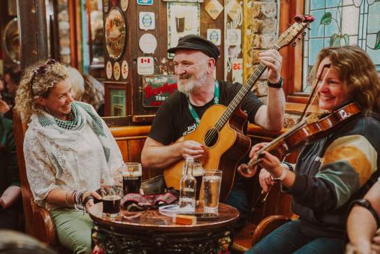 Musicians playing a traditional Irish music session as part of Belfast TradFest.
