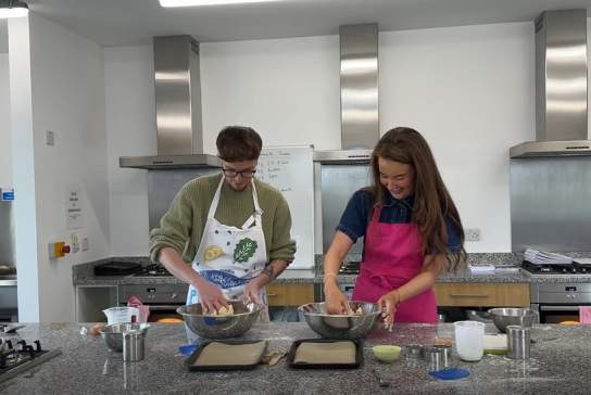 Influencer CatherineLauraM enjoying a cooking lesson at Wee Buns Cookery School.