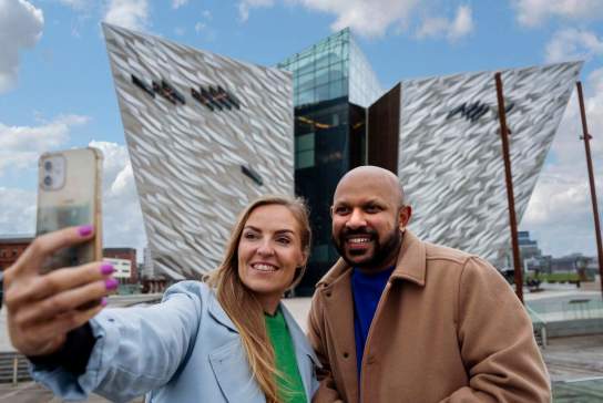 Couple taking a selfie in front of Titanic Belfast