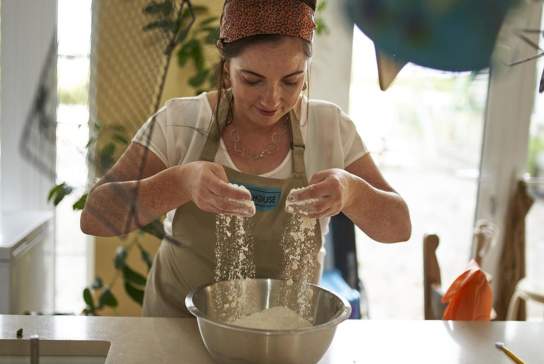 Bronagh with a bowl of flour in front of her baking