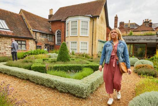 Women walking in the tudor house garden