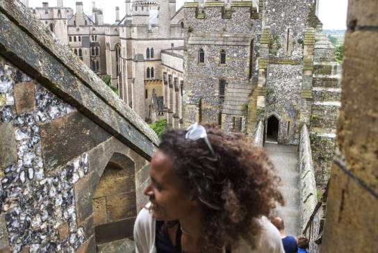 Lady walking up the stairs outside Arundel Castle