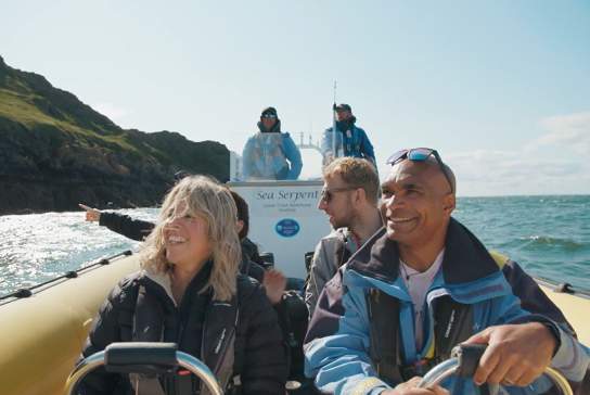 A boat full of people sightseeing