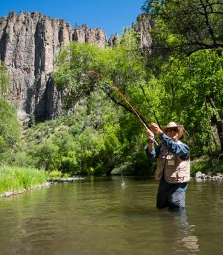 An angler enjoys fishing in the Gila River.