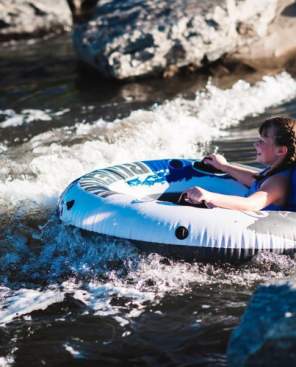 Young person tubing at Dicken's Farm
