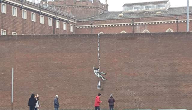 Banksy artwork on the wall of Reading Prison