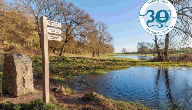 View of the source of the Thames and signpost for Thames Path