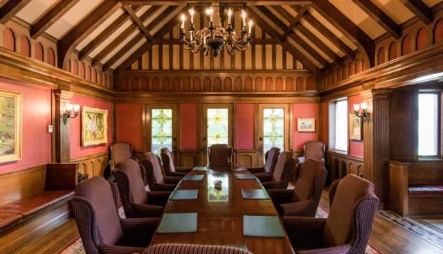 Boardroom with table and vaulted ceiling at McCune mansion