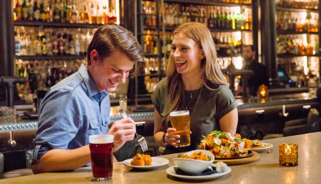 Couple eating at bar at Lake Effect