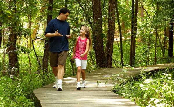 Father and Daughter on Trail Hike in Southeast Texas