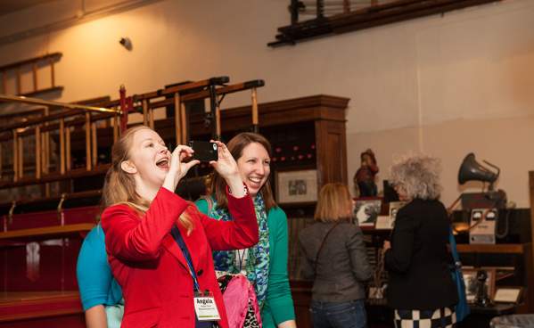 Convention attendee takes photo at Fire Museum conference event