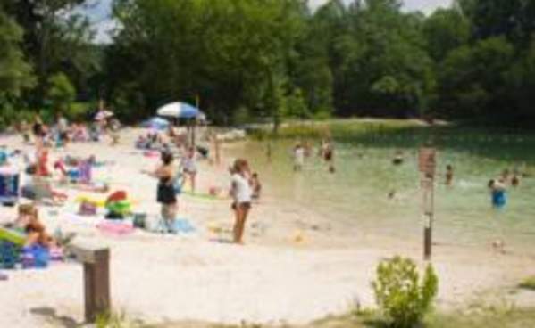 Swimmers at Fuller Lake beach in Pine Grove Furnace State Park.