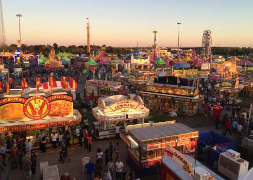 Fair booths and people at the South Texas State Fair