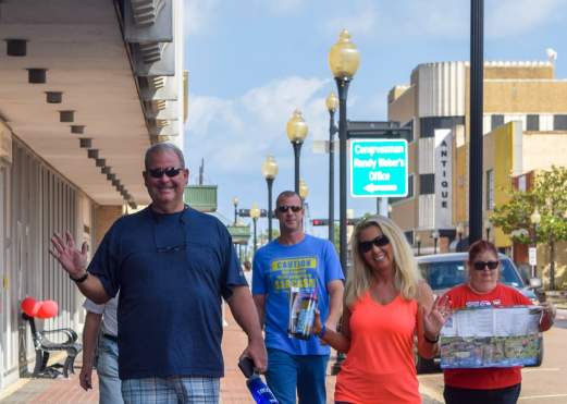 A group of people enjoying touring the geocaching attractions in downtown Beaumont.